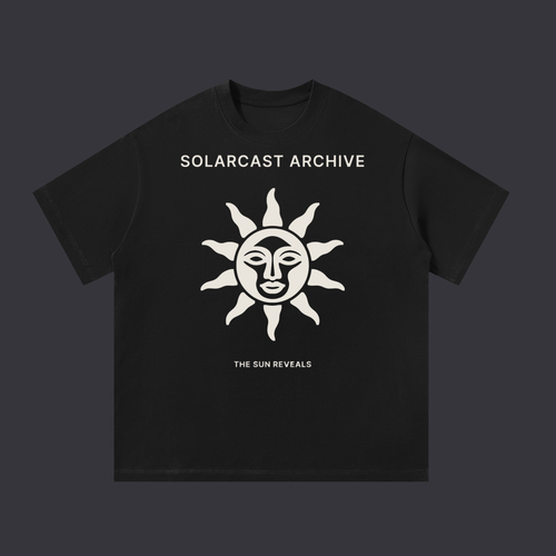 The Sun Reveals tee: a bone print on the front showing a sun with a face and rays above the words The Sun Reveals, on a black cotton tee.