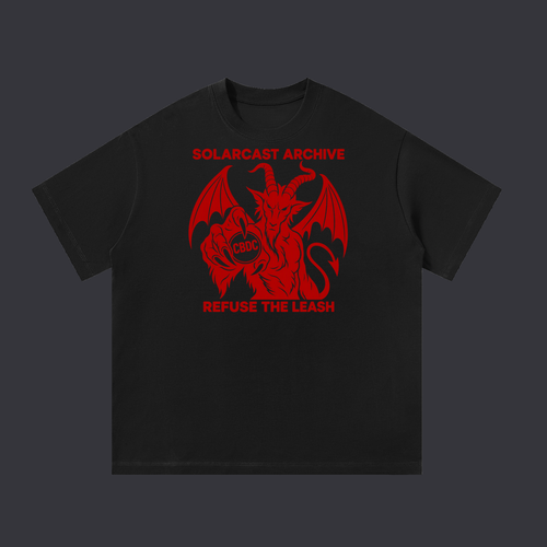 Refuse The Leash tee: a red print on the front showing a winged devil holding a coin marked CBDC, above the words Refuse The Leash, on a black cotton tee.